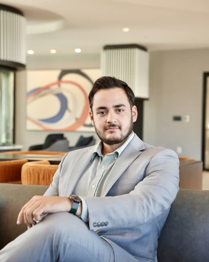 Mark Orlowski seated in a modern lounge